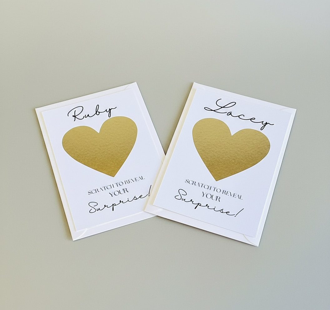 Two scratch cards with gold hearts and text